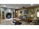 Spacious living room with stone fireplace and mounted game for decoration at 7180 Westray Rd, Cumming, GA 30028