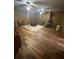 Cozy living room features hardwood floors, area rug, and ceiling fans at 7180 Westray Rd, Cumming, GA 30028