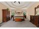Spacious main bedroom featuring tray ceiling, and large bed set at 7180 Westray Rd, Cumming, GA 30028
