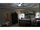 Tranquil main bedroom with a four-poster bed, tray ceiling, and ensuite bathroom at 7180 Westray Rd, Cumming, GA 30028