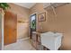 Functional mud room area equipped with sink, storage baskets, and convenient access to the outdoors at 7180 Westray Rd, Cumming, GA 30028