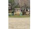 Outdoor playground features a slide, swings, and a covered area for chickens or other small animals at 7180 Westray Rd, Cumming, GA 30028