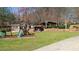 Backyard playground set with slide, swings and chicken coop, great for families at 7180 Westray Rd, Cumming, GA 30028