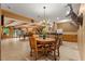 Large recreation room with tile floors, a pool table, and a bar area at 7180 Westray Rd, Cumming, GA 30028