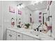 Bright bathroom with double sinks, marble countertops, and elegant lighting fixtures at 144 Wetherbrooke Ln # 4, Smyrna, GA 30082