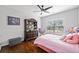 Cozy bedroom with hardwood floors, a dark wood dresser, and plenty of natural light at 144 Wetherbrooke Ln # 4, Smyrna, GA 30082