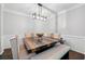 Formal dining room with decorative lighting, seating, and trim at 144 Wetherbrooke Ln # 4, Smyrna, GA 30082