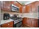 Close-up of a well-equipped kitchen with stainless steel gas range at 144 Wetherbrooke Ln # 4, Smyrna, GA 30082
