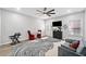 Bright living room with a ceiling fan, a grey sofa, abstract rug, and large windows for natural light at 144 Wetherbrooke Ln # 4, Smyrna, GA 30082