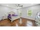 Spacious primary bedroom with decorative wall trim, hardwood floors, and stylish furniture at 144 Wetherbrooke Ln # 4, Smyrna, GA 30082