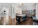 Spacious recreation room with game table and built-in bookshelf at 144 Wetherbrooke Ln # 4, Smyrna, GA 30082