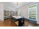 Well-lit recreation room featuring an air hockey table and bookshelf at 144 Wetherbrooke Ln # 4, Smyrna, GA 30082