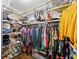 Organized walk-in closet with custom shelving, hanging rods, and ample storage space at 144 Wetherbrooke Ln # 4, Smyrna, GA 30082