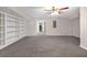 Spacious finished basement featuring built-in bookshelves and neutral carpeting at 1665 Little Lisa Ln, Snellville, GA 30078