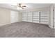 Finished basement featuring carpet and built in shelving at 1665 Little Lisa Ln, Snellville, GA 30078