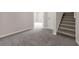 Basement featuring carpet, staircase, and an open entryway at 1665 Little Lisa Ln, Snellville, GA 30078