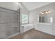 Bright bathroom featuring a shower, tub, and double vanity at 1665 Little Lisa Ln, Snellville, GA 30078