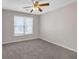 Bedroom featuring a ceiling fan and a large window at 1665 Little Lisa Ln, Snellville, GA 30078