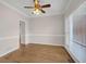 Empty dining room with hardwood floors and a large window showing wainscoting at 1665 Little Lisa Ln, Snellville, GA 30078