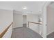 Upstairs hallway with carpet floor, and wooden railings at 1665 Little Lisa Ln, Snellville, GA 30078