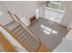 Aerial view of a living room featuring a fireplace, many windows, and a staircase at 1665 Little Lisa Ln, Snellville, GA 30078