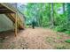 Backyard showing the wooden stairs leading to the back door of the home at 2132 Sara Ashley Way, Lithonia, GA 30058