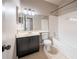 Bathroom with a vanity, a toilet, and a tub with a white tile surround at 2132 Sara Ashley Way, Lithonia, GA 30058