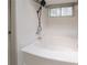 Bright bathroom with a white tiled shower and tub at 2132 Sara Ashley Way, Lithonia, GA 30058