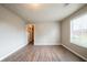 Spacious room with wood floors, a window and access to other rooms at 2132 Sara Ashley Way, Lithonia, GA 30058