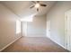 Spacious bedroom featuring plush carpeting, two closets, and neutral-colored walls at 2132 Sara Ashley Way, Lithonia, GA 30058