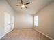 Bright and spacious bedroom with a ceiling fan, neutral paint, and plush carpeting at 2132 Sara Ashley Way, Lithonia, GA 30058