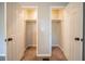 Carpeted closets with standard shelving and access doors at 2132 Sara Ashley Way, Lithonia, GA 30058