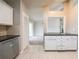 Kitchen area with white cabinets, stainless steel appliances, and tiled backsplash at 2132 Sara Ashley Way, Lithonia, GA 30058