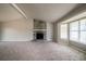 Open living room with stone fireplace and large windows, providing ample natural light at 2132 Sara Ashley Way, Lithonia, GA 30058