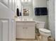 Bathroom featuring a vanity, mirror, and shower-tub combination with gray accents at 2513 Ivey Crest Cir, Tucker, GA 30084
