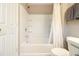 Clean bathroom with a shower-tub combination and built-in shelving at 2513 Ivey Crest Cir, Tucker, GA 30084