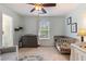 Bright bedroom with a crib, changing table, and neutral color scheme at 2513 Ivey Crest Cir, Tucker, GA 30084