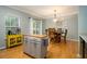 Bright eat-in kitchen with view to the dining table set and sliding door to back at 2513 Ivey Crest Cir, Tucker, GA 30084