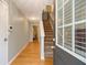 Bright foyer with hardwood floors, staircase, and view of a bedroom at 2513 Ivey Crest Cir, Tucker, GA 30084