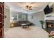 Cozy living room with a fireplace, large sectional sofa, and ample natural light at 2513 Ivey Crest Cir, Tucker, GA 30084