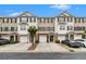 Charming townhouse exterior with attached garages and well-maintained landscaping at 2513 Ivey Crest Cir, Tucker, GA 30084