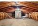 Spacious unfinished attic with exposed wood beams and brick chimney at 620 Shannon Green Sw Cir, Mableton, GA 30126