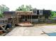 Backyard view of home, wooden deck, pergola, and fenced yard at 620 Shannon Green Sw Cir, Mableton, GA 30126