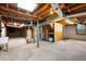 Unfinished basement area with concrete floor, exposed ceiling, and utility connections at 620 Shannon Green Sw Cir, Mableton, GA 30126