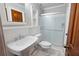 Bright bathroom with a glass-enclosed shower, white tiling, and modern fixtures at 620 Shannon Green Sw Cir, Mableton, GA 30126