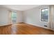 Light-filled bedroom with hardwood floors and neutral walls, creating a calming retreat at 620 Shannon Green Sw Cir, Mableton, GA 30126