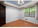 Cozy bedroom with hardwood floors, and a large window, offering natural light and pleasant views at 620 Shannon Green Sw Cir, Mableton, GA 30126