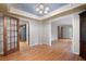Open dining room with decorative ceiling and hardwood floors, great for entertaining guests at 620 Shannon Green Sw Cir, Mableton, GA 30126