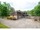Charming home with a brick exterior, covered carport, and well-maintained landscaping at 620 Shannon Green Sw Cir, Mableton, GA 30126