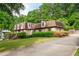 Traditional home with dormer windows, brick facade, and a well-manicured front lawn at 620 Shannon Green Sw Cir, Mableton, GA 30126